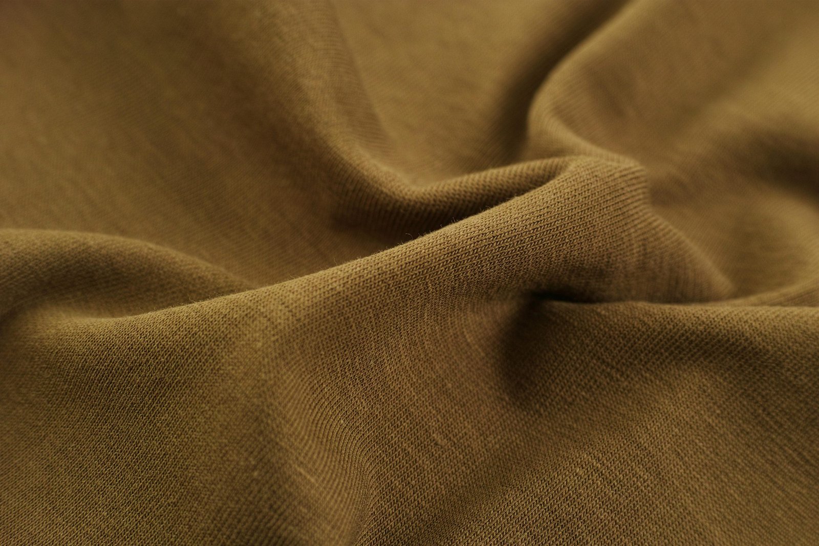 Macro shot of soft, fuzzy pink fabric texture illustrating high-quality hand feel.