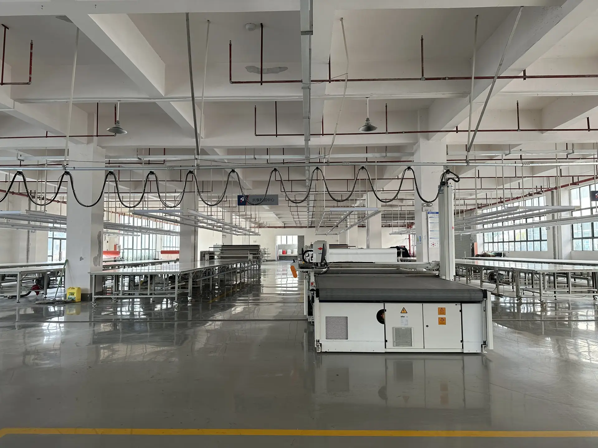 Quality control inspection at a small batch clothing manufacturer in China.