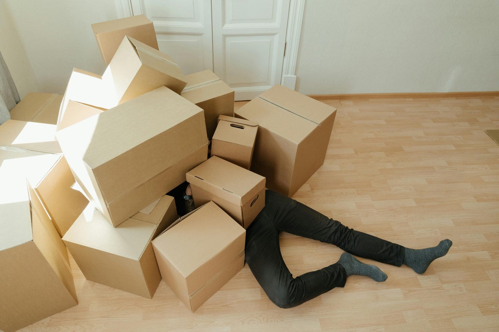 a man are buried by boxes