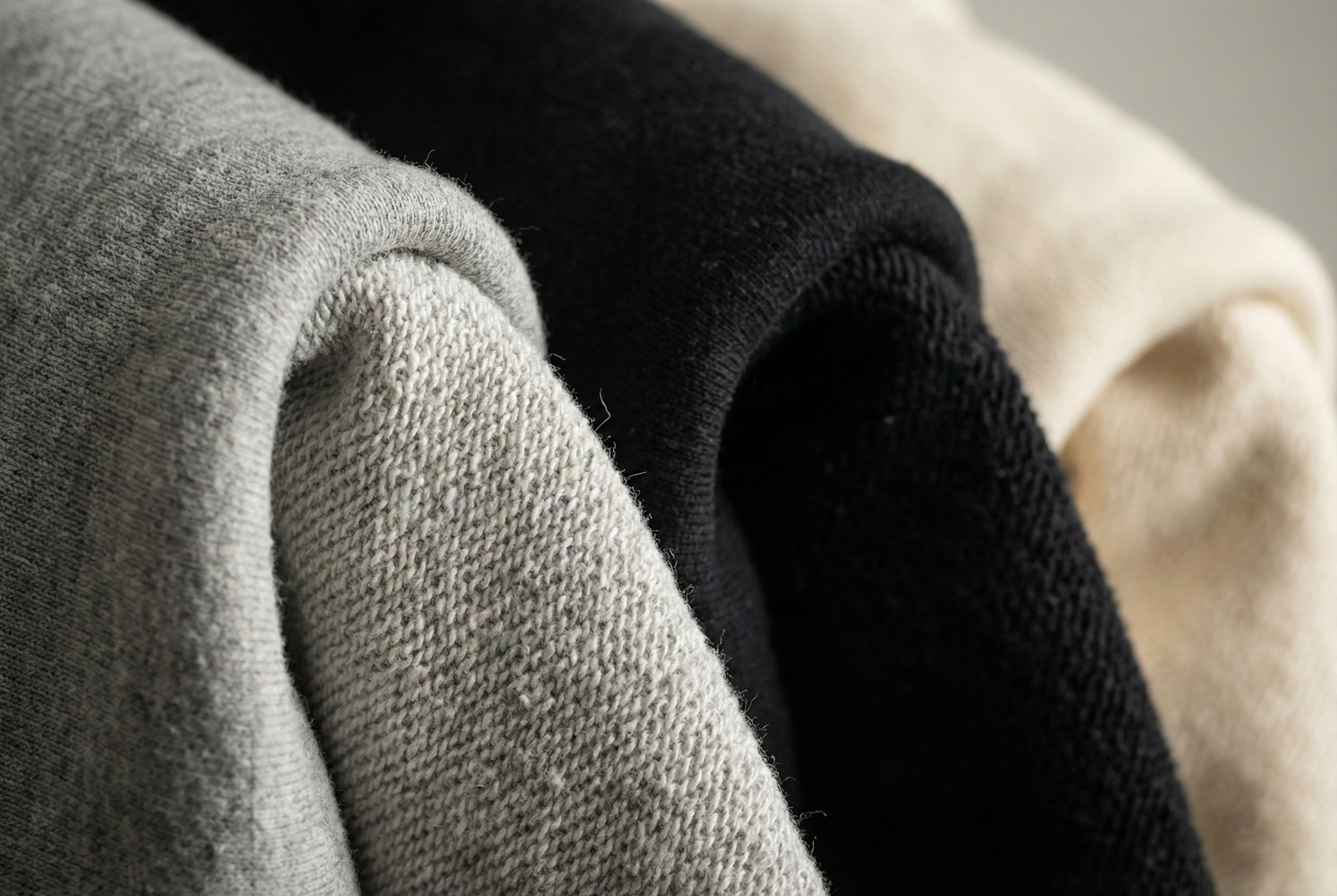 Close-up macro shot of 400gsm heavyweight cotton fleece fabric texture for premium hoodies