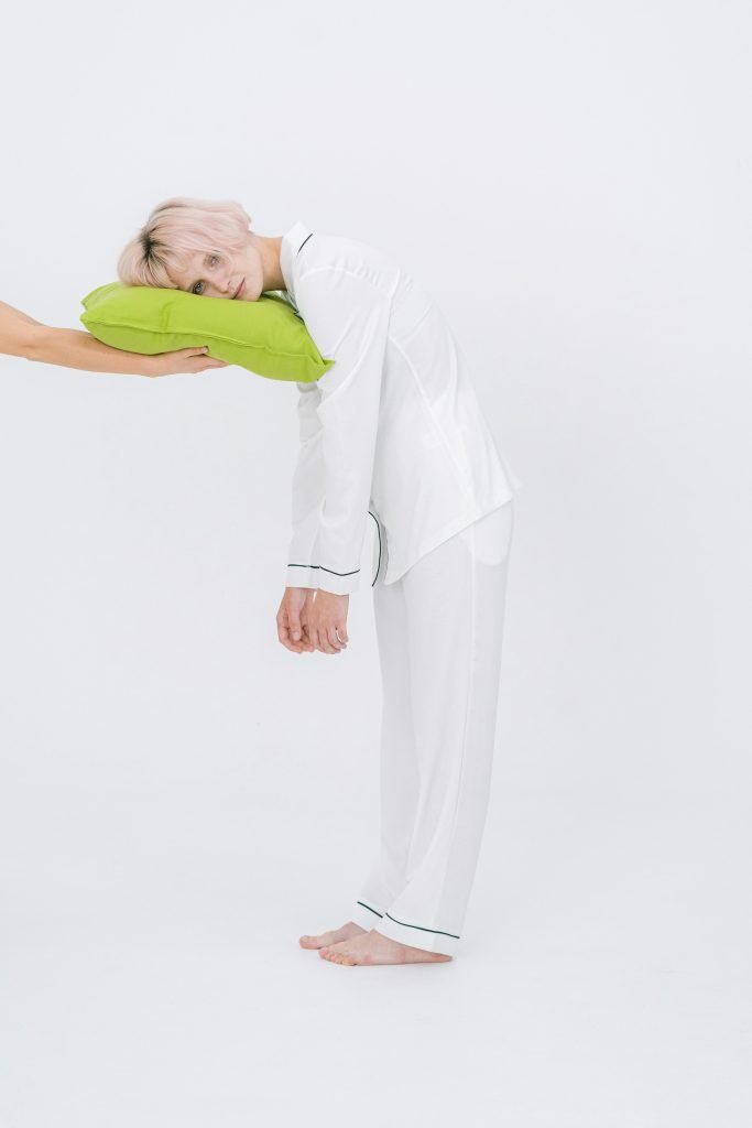 Minimalist white sleepwear with green accents, ideal for brands looking for eco-friendly bamboo pajama manufacturers.