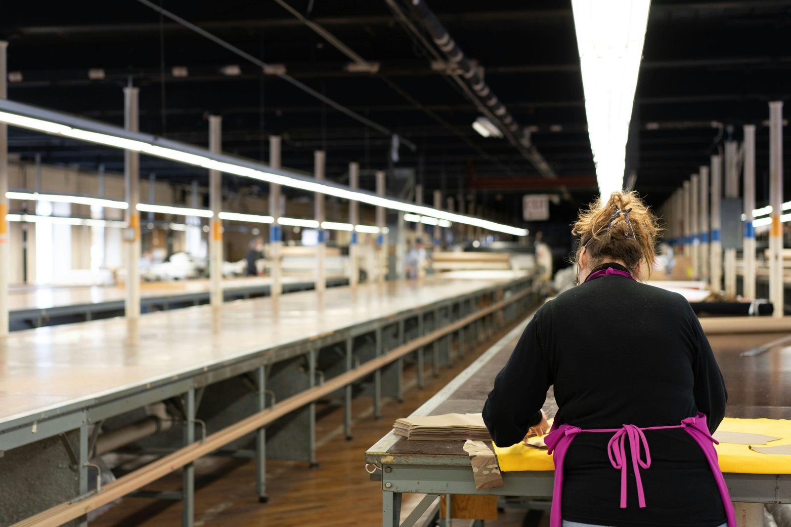 Clean and modern production line at an apparel manufacturer factory.