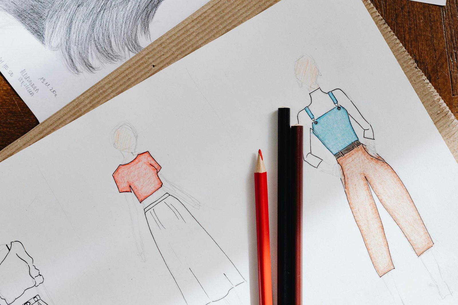 Fashion designer sketches for a custom cut and sew clothing line.
